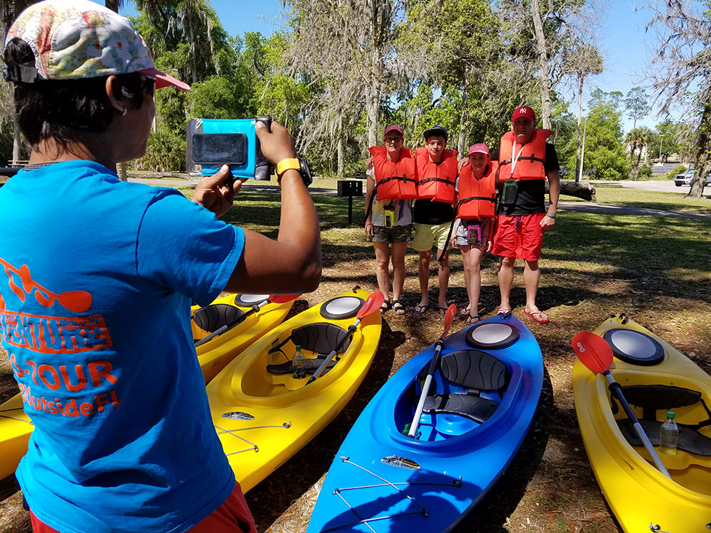 eco tour guide helping guest