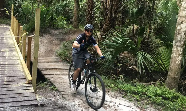 Man riding a bike through Seminole State Forest