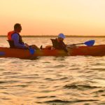Father and child kayaking at sunset on Florida’s Space Coast with BK Adventure