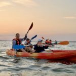 Father and child kayaking at sunset on Florida’s Space Coast with BK Adventure