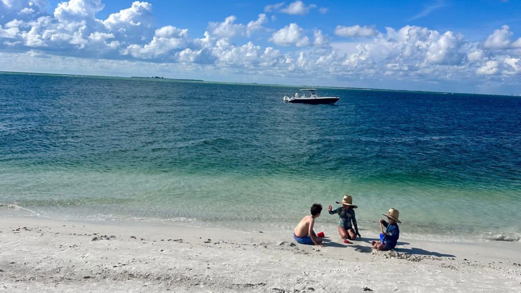 Cover - Kids playing on the shore of Bean Point, Anna Maria Island, Florida