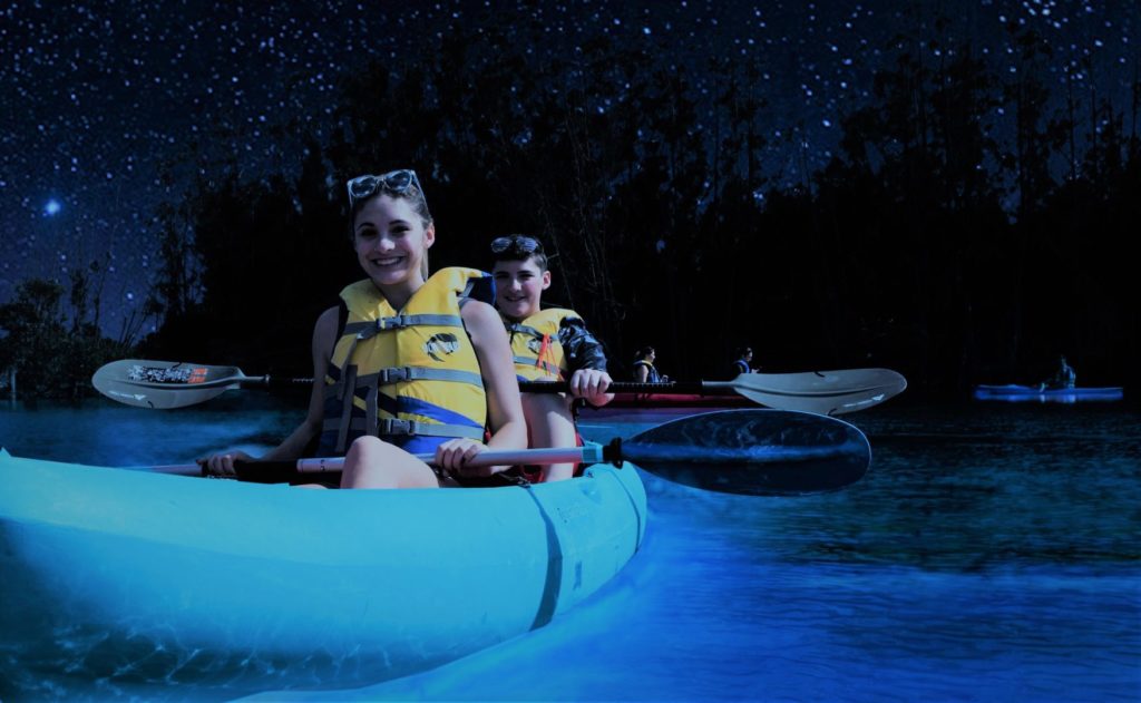 Young Couple Kayaking in Bioluminescent Waters near Orlando, Florida